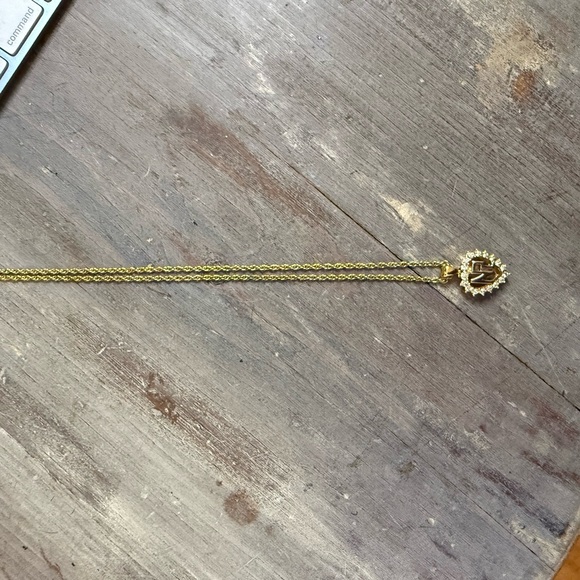 Nina Ricci Gold Sunburst Pendant Necklace